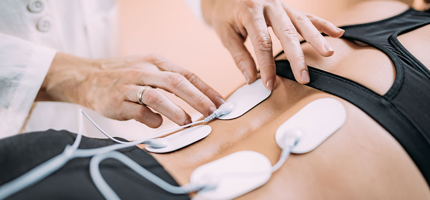 patient receiving Electrical Muscle Stimulation in College Park for auto accident injury relief